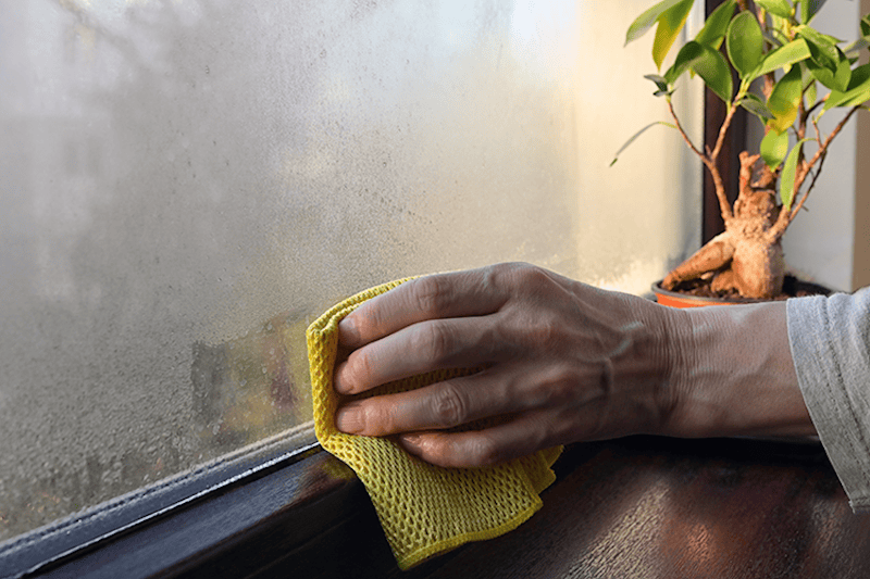 Wiping the condensation off the window