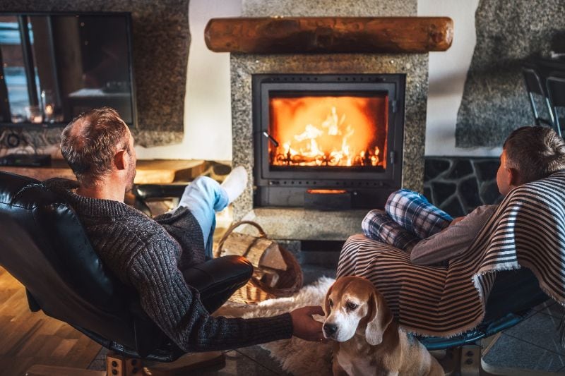 The Basics of Winter Indoor Air Quality - Cozy Family by the Fireplace.